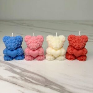 Handmade Rose Teddy Candles in pastel colours, crafted with eco-friendly soy wax and tiny rose details — perfect for décor and gifting.