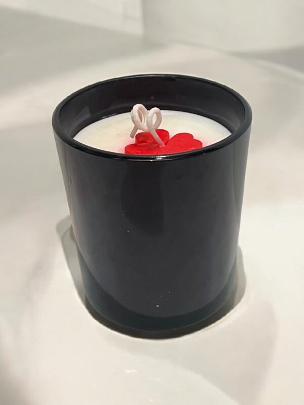 Glossy black jar candle with soy wax and elegant design, perfect for home décor and gifting.