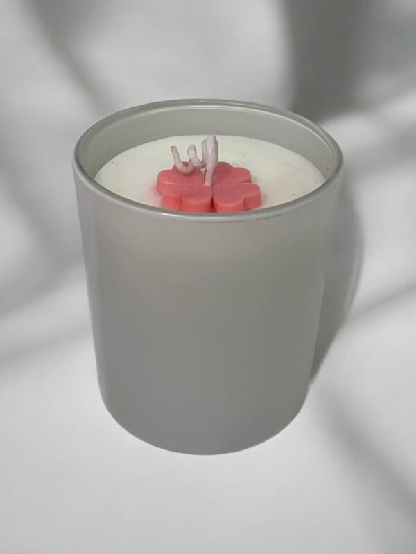 Glossy white scented jar candle with floral wax top by Aesthetic Flames