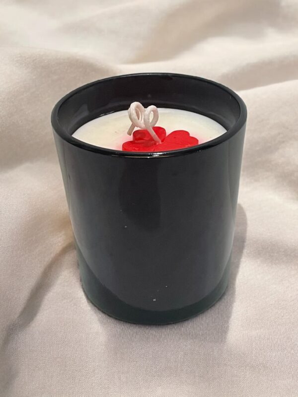 Glossy black jar candle with soy wax and elegant design, perfect for home décor and gifting.