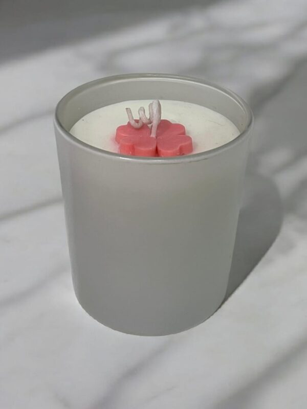 Glossy white scented jar candle with floral wax top by Aesthetic Flames