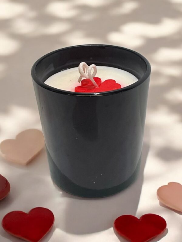Glossy black jar candle with soy wax and elegant design, perfect for home décor and gifting.