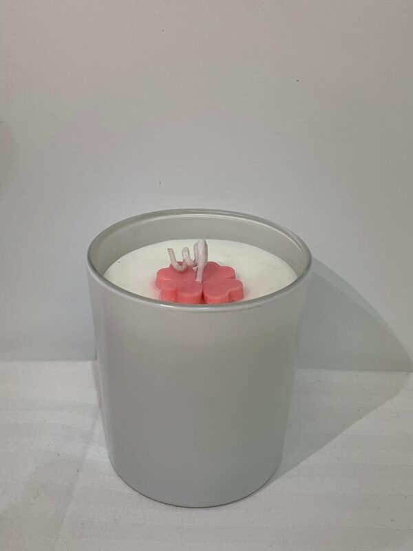 Glossy white scented jar candle with floral wax top by Aesthetic Flames