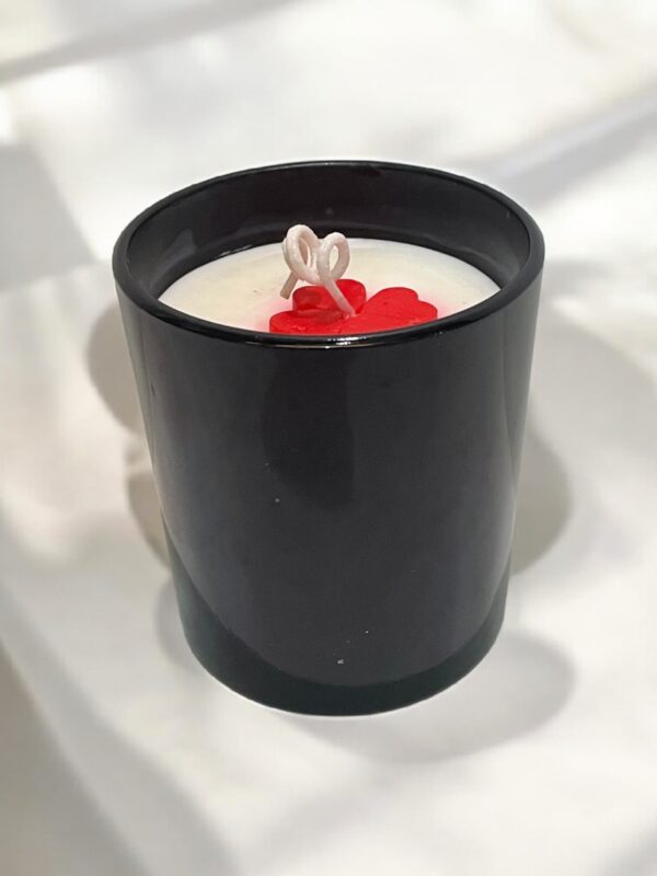 Glossy black jar candle with soy wax and elegant design, perfect for home décor and gifting.