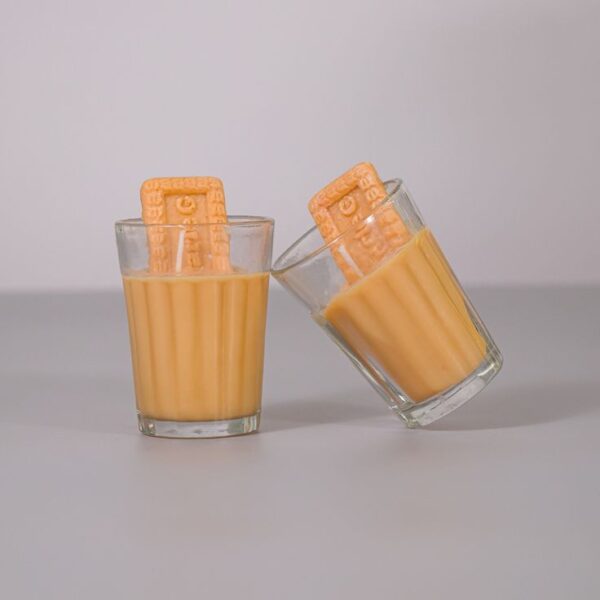 Handmade Chai Biscuit Candle in glass cup with realistic biscuit-shaped wax topper
