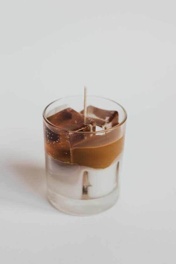 Realistic Iced Latte Candle in clear glass with wax ice cubes and layered coffee milk design